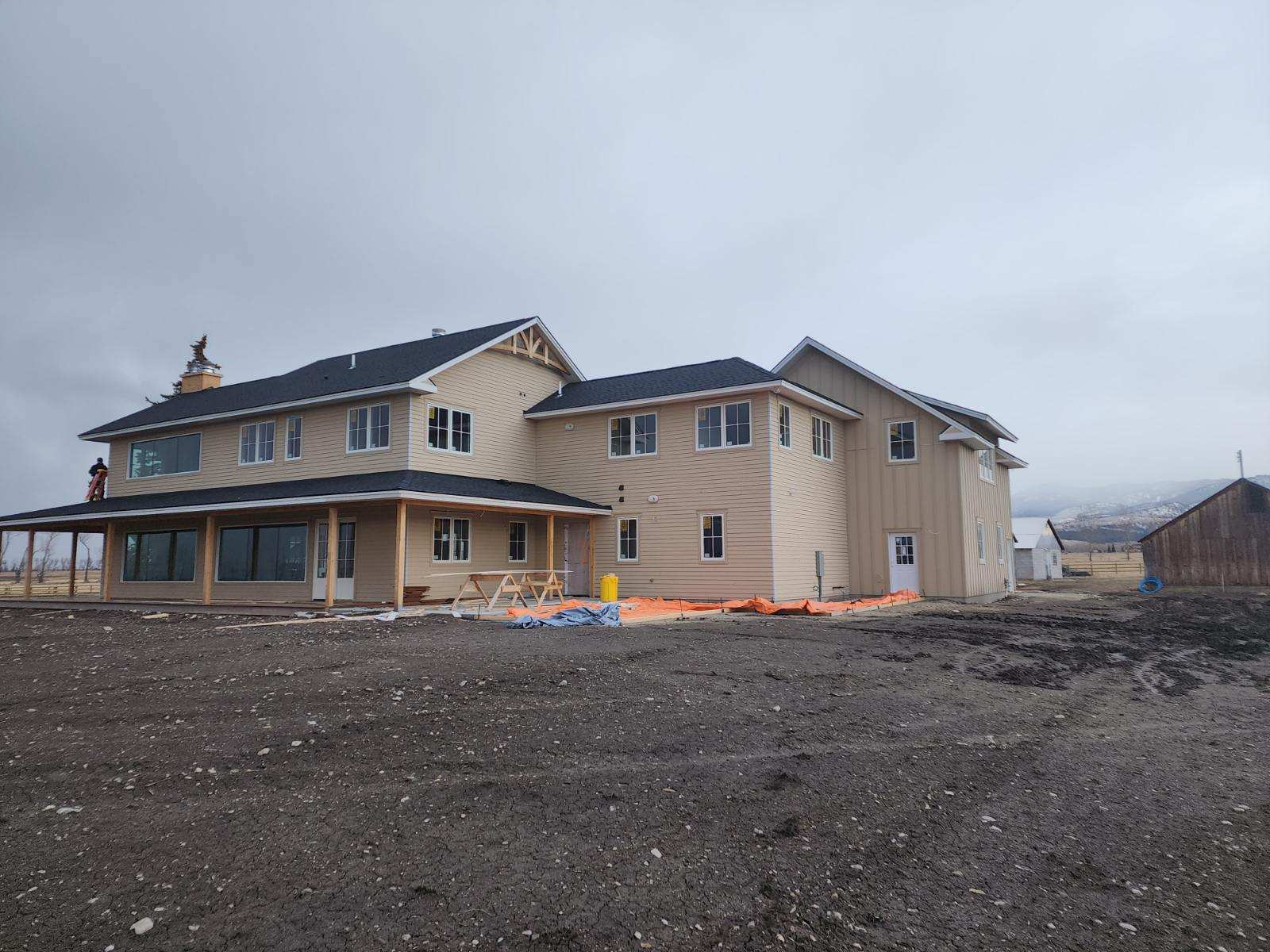 Montana custom home framing at sunset